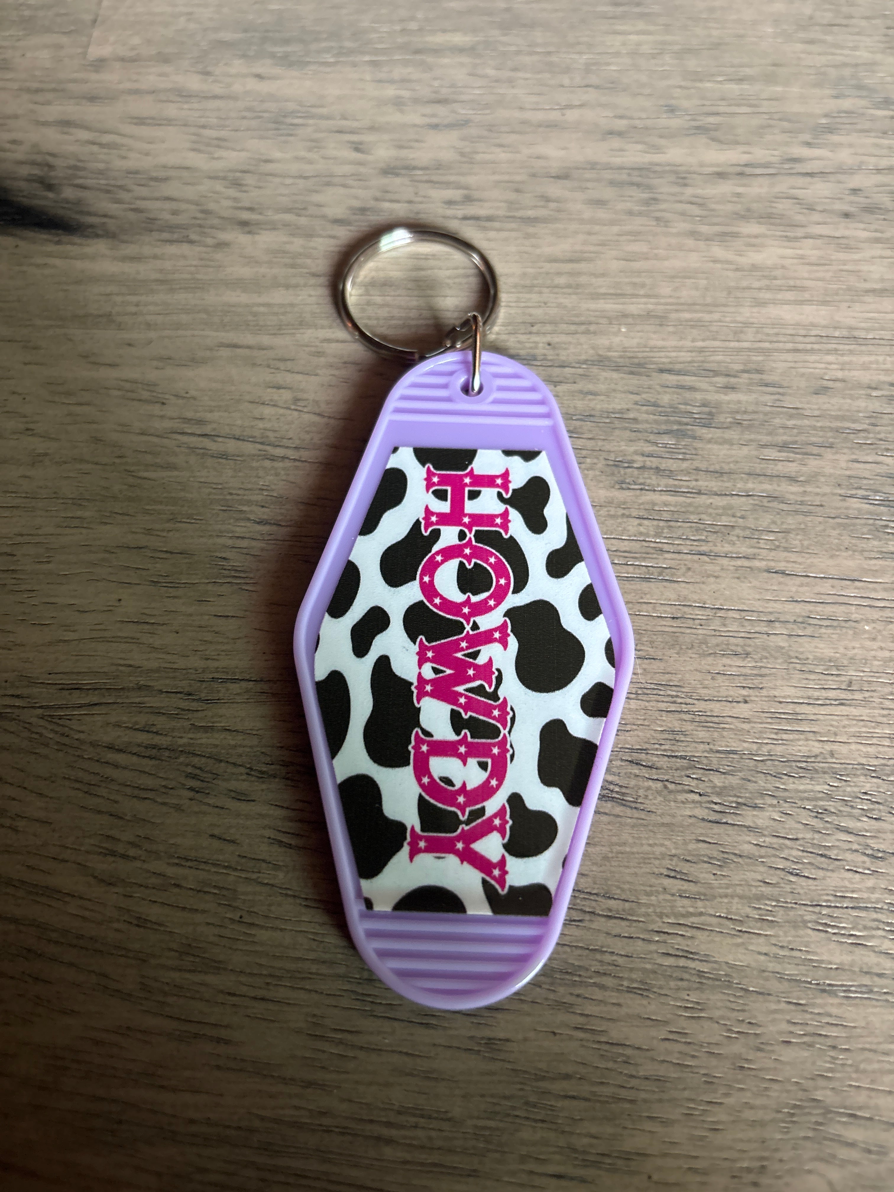Howdy with cowprint motel keychain