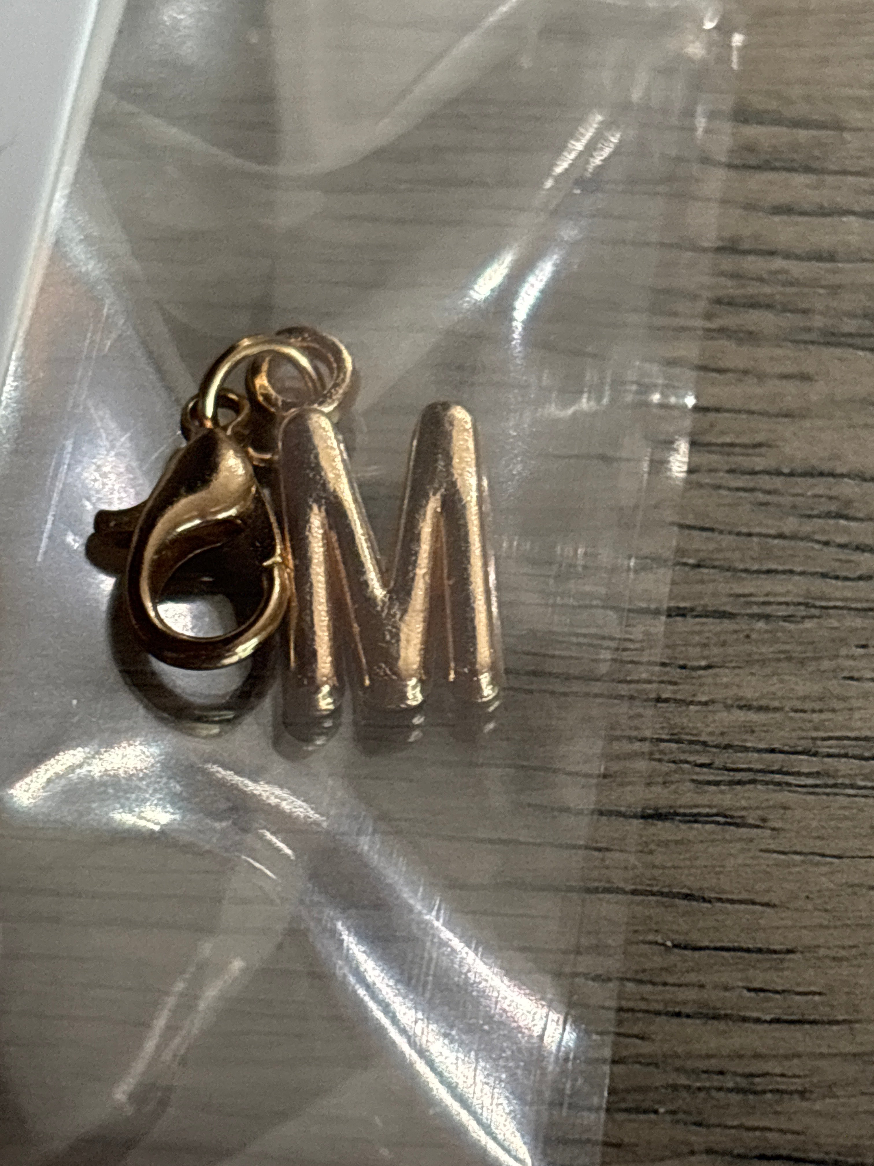 M gold charm