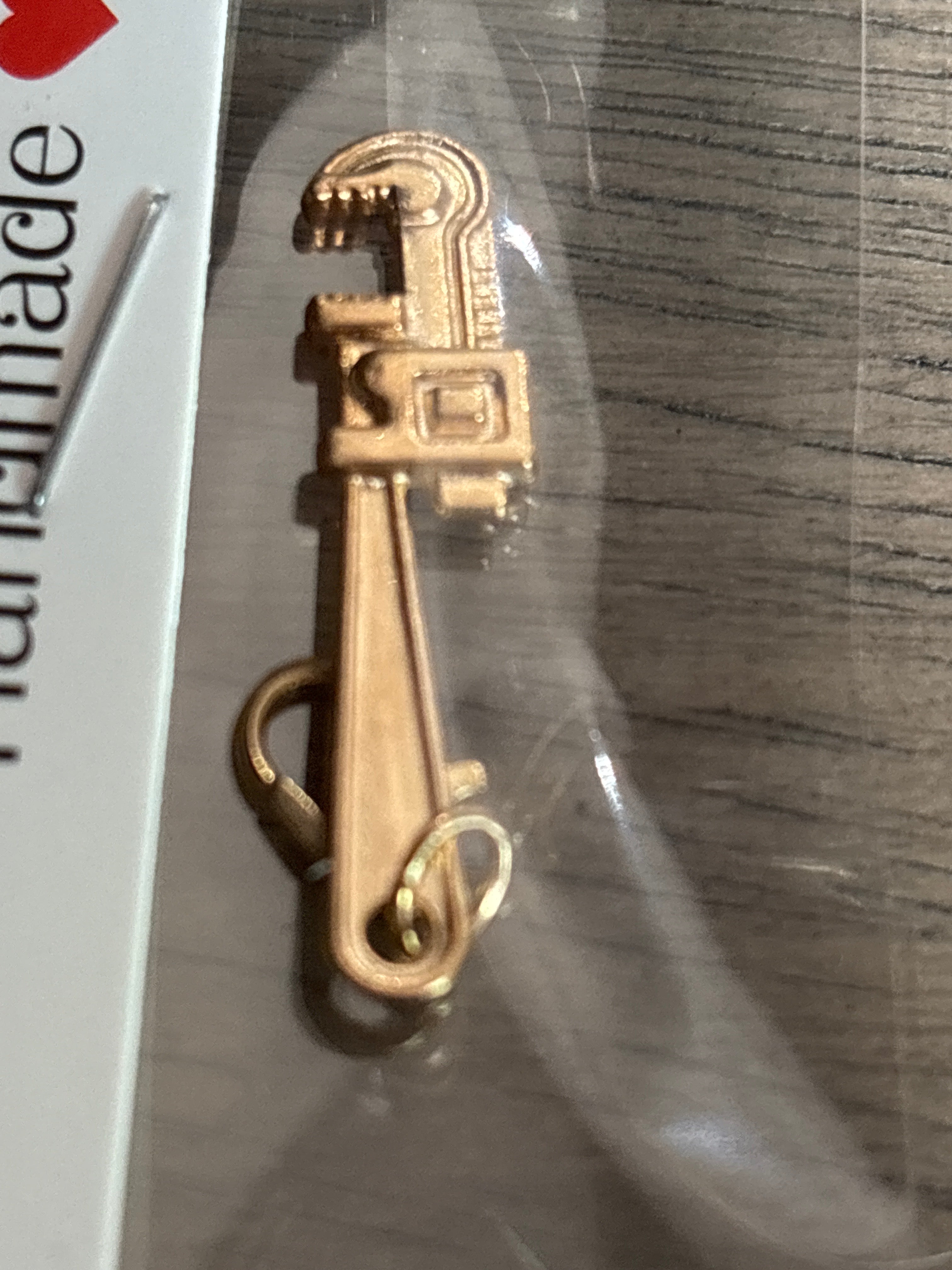 Gold wrench charm