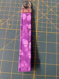 Purple butterfly wristlet