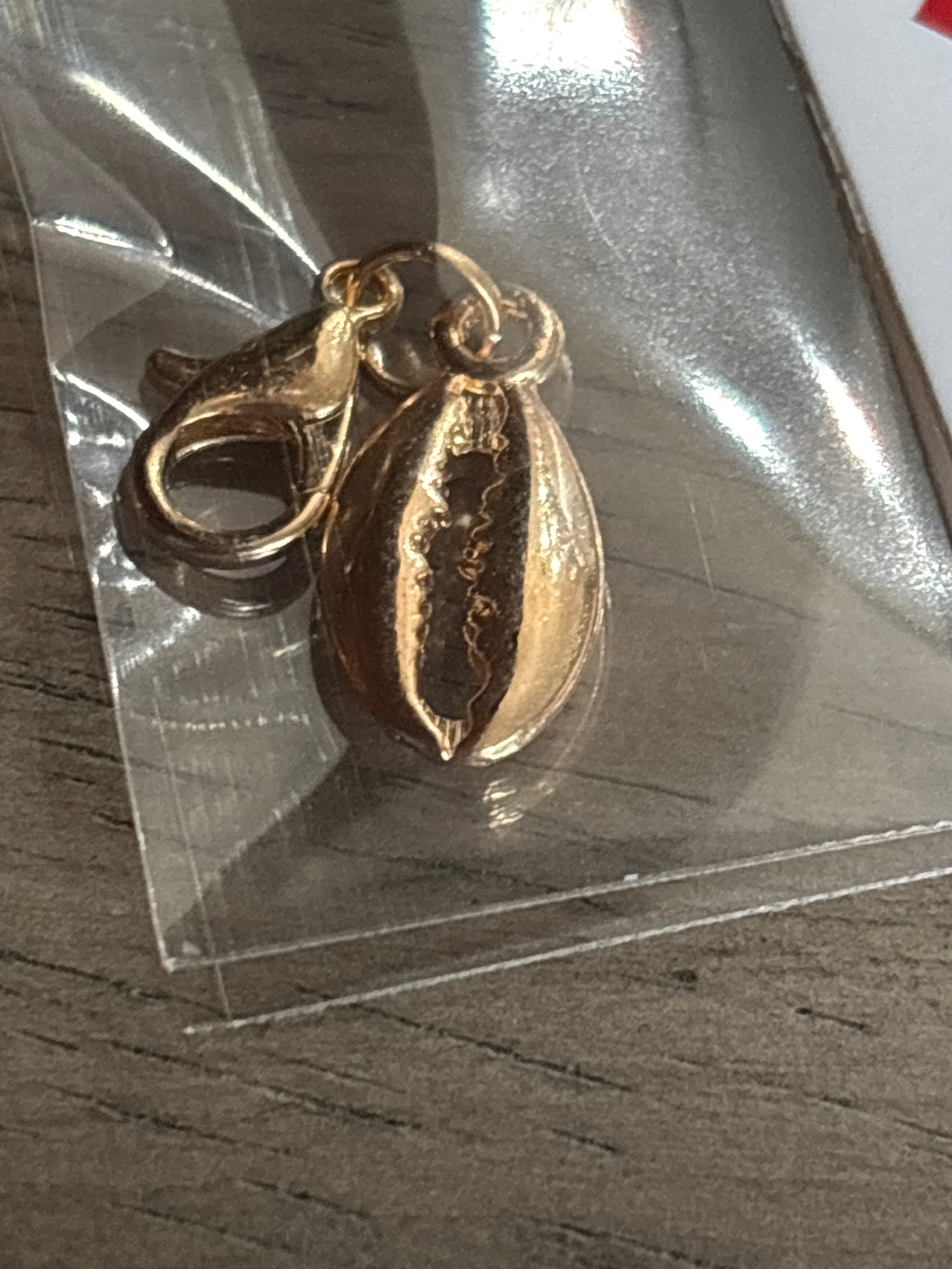 Gold shell charm
