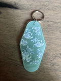 Blue flowers motel keychain