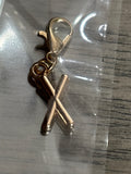 X gold charm