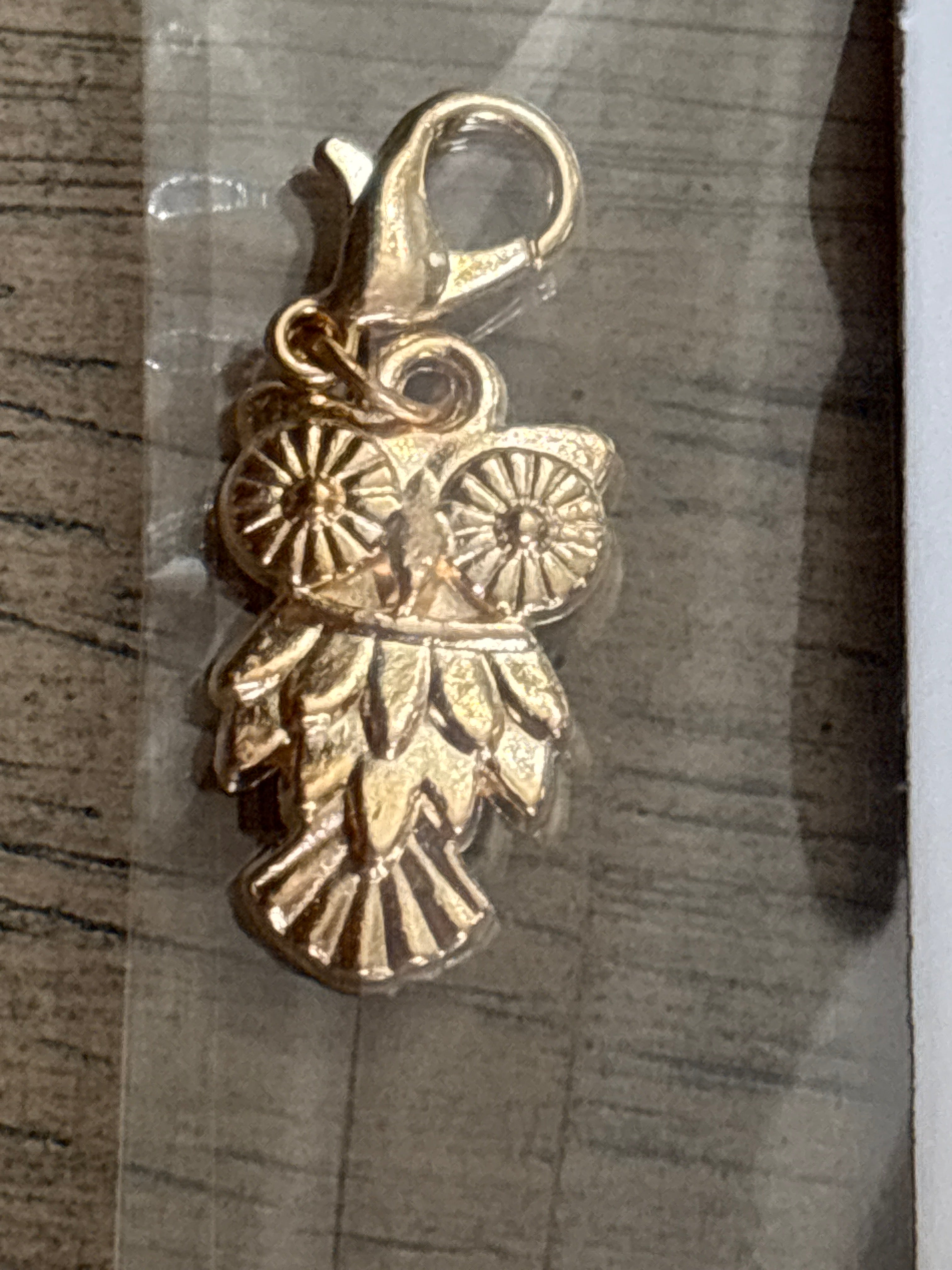Gold owl charm