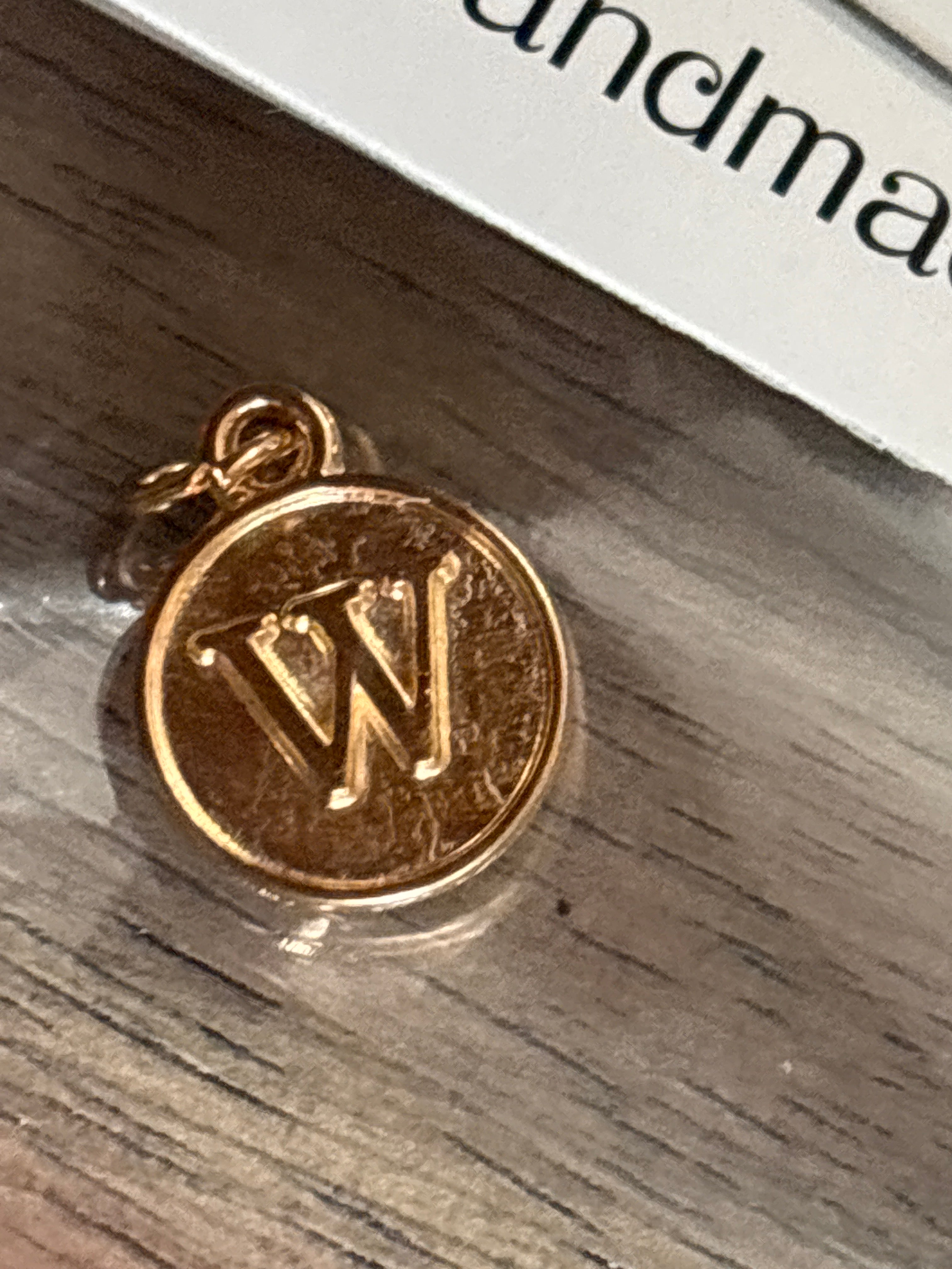 Gold w charm