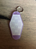 Purple with white bows motel keychain
