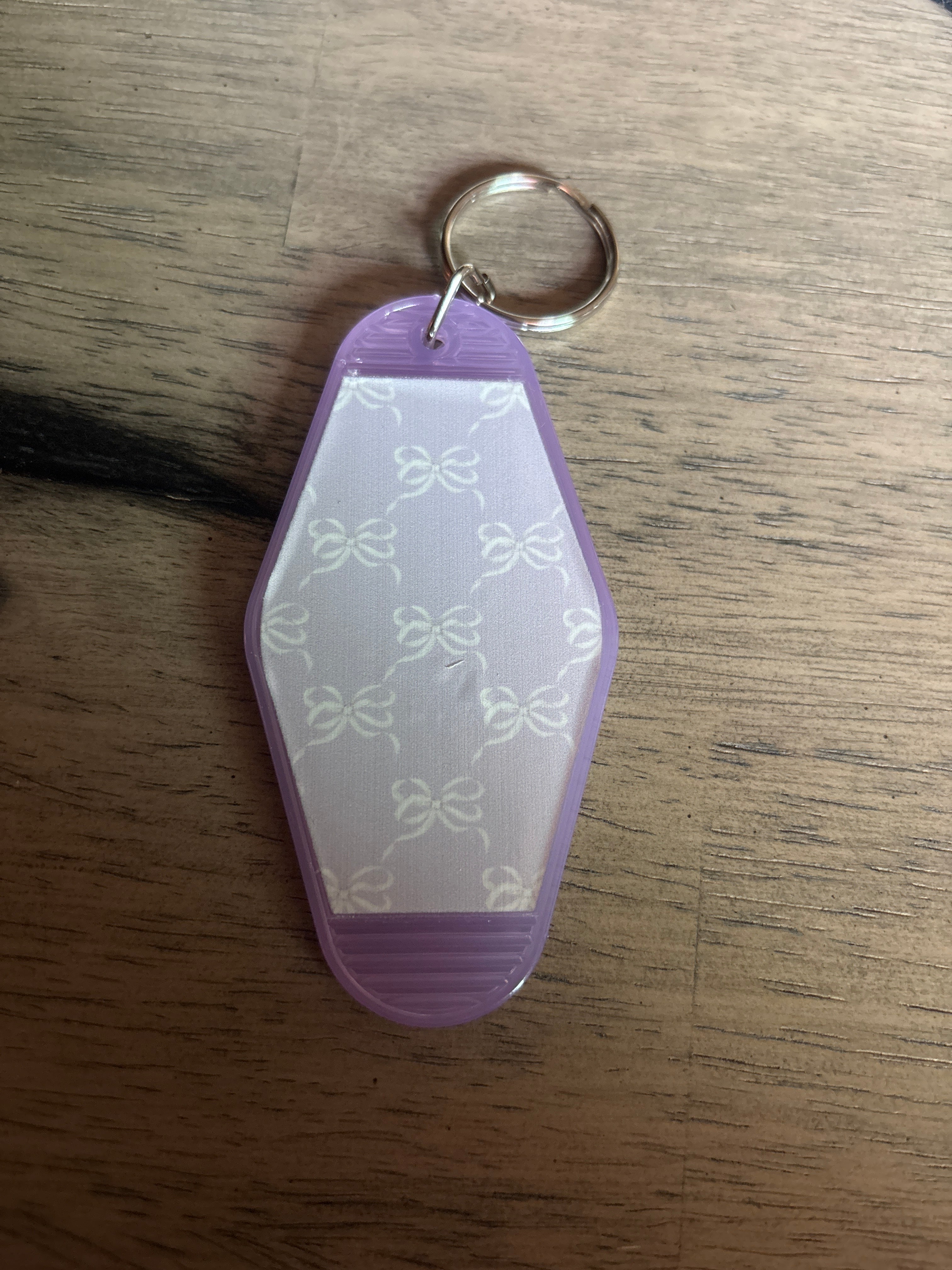 Purple with white bows motel keychain
