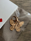 Gold butterfly charm