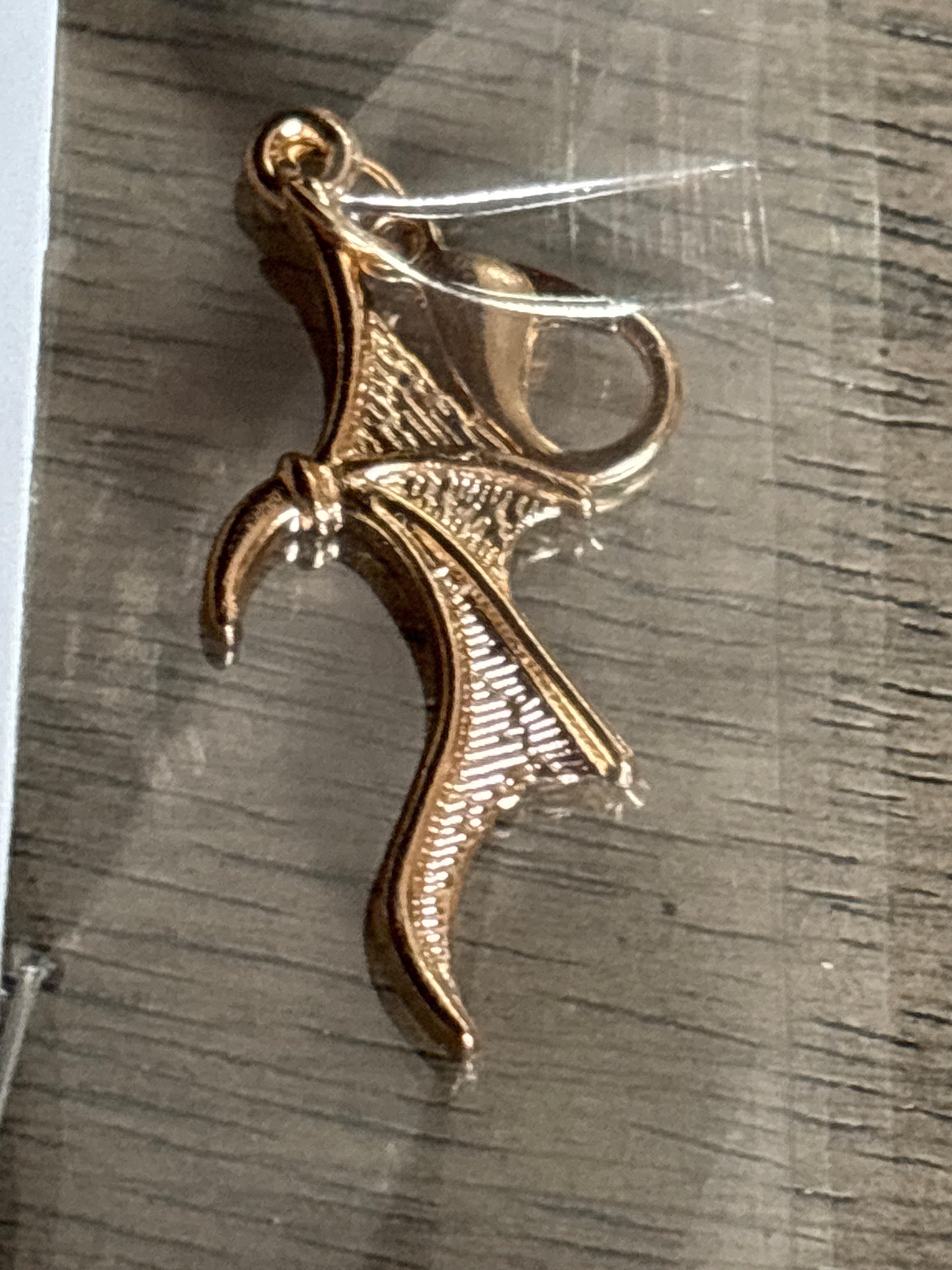 Gold wing charm