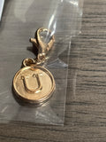 Gold U charm