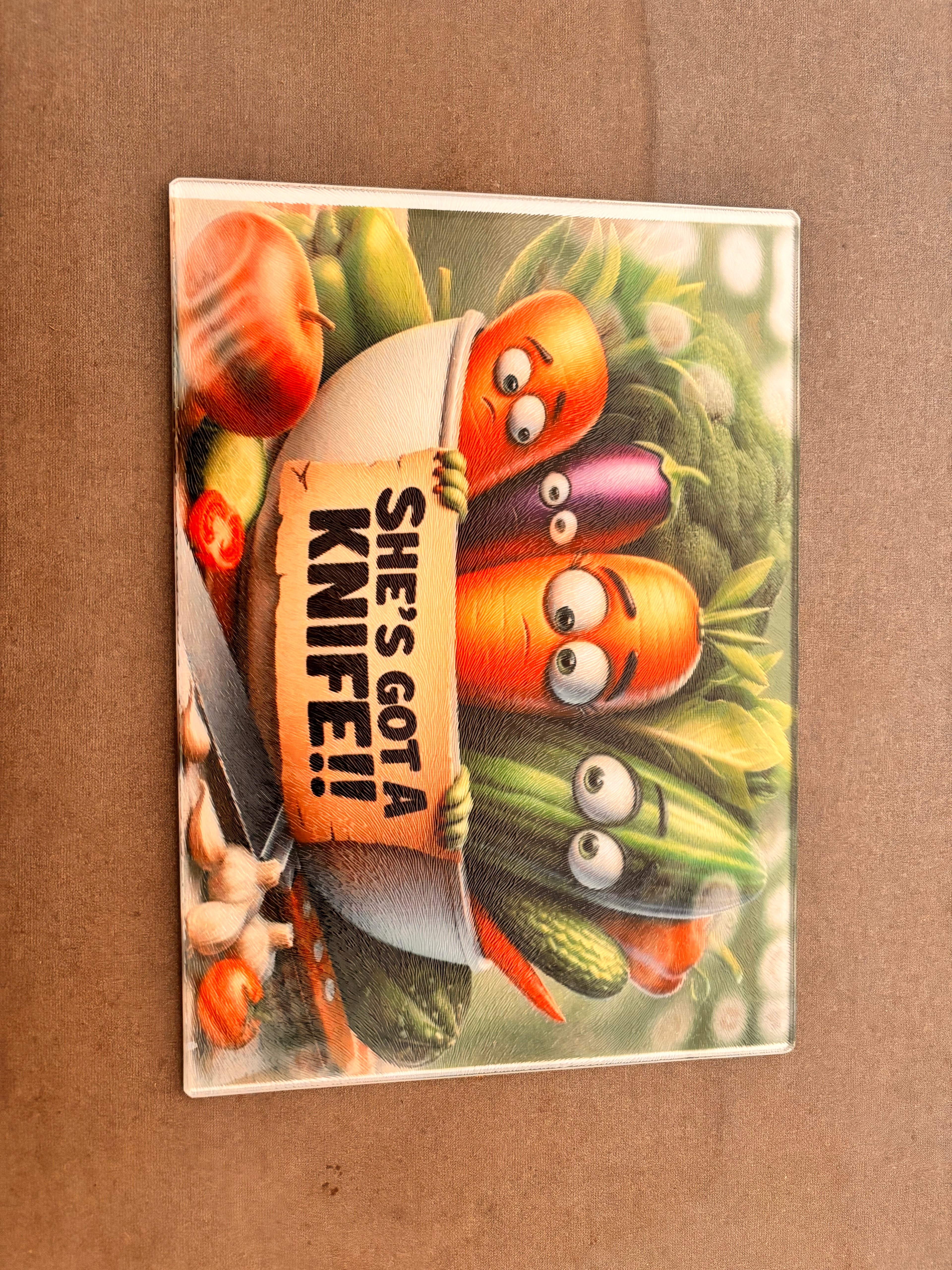 She’s got a knife Glass Cutting board